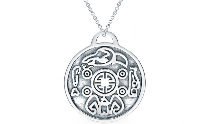 a silver coin as an amulet for happiness